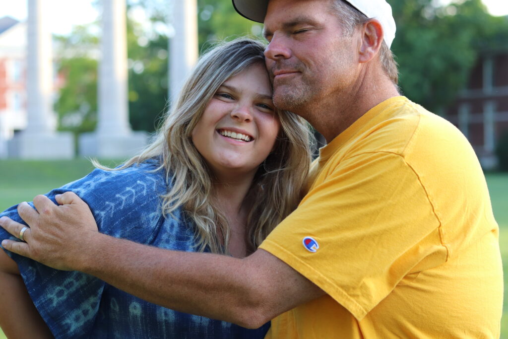 dad hugging daughter