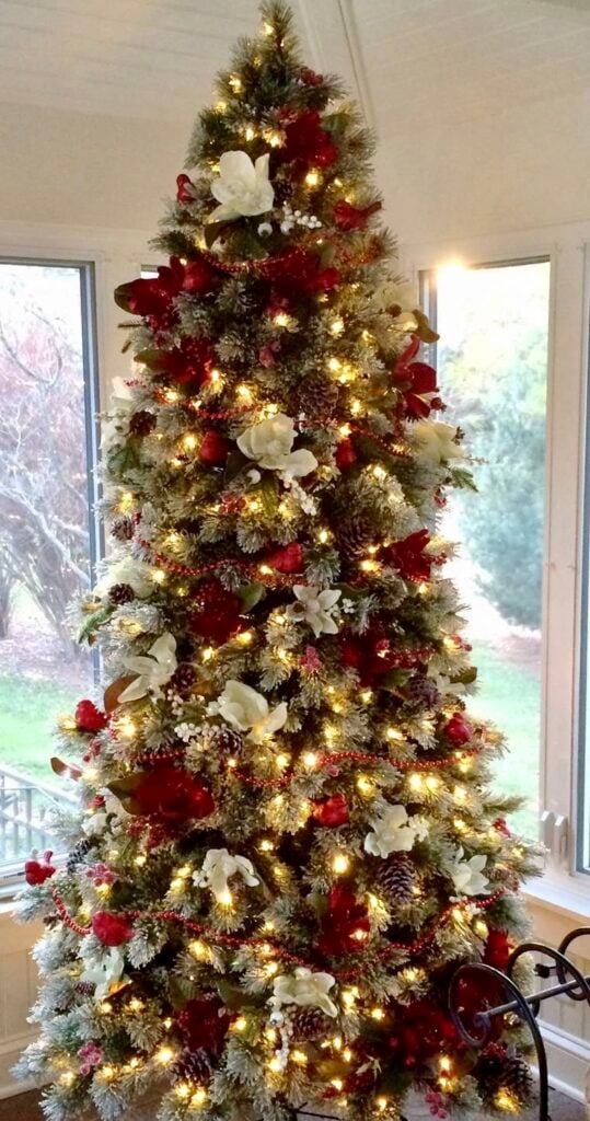 beautifully decorated christmas tree with reds and whites