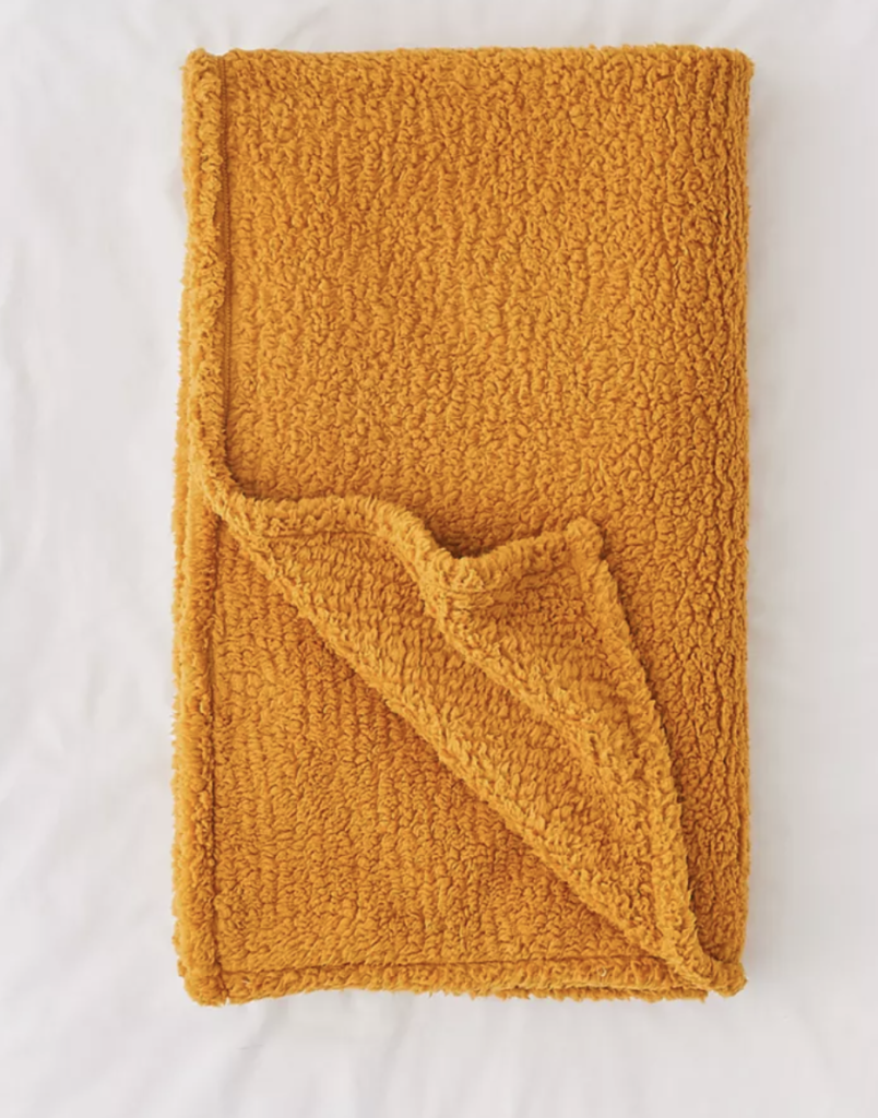 rusty orange soft throw for an apartment bed or couch