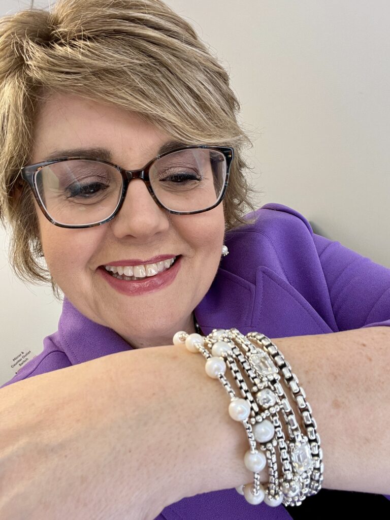 Jill Bauer looking at bracelets by Jai Jewelry